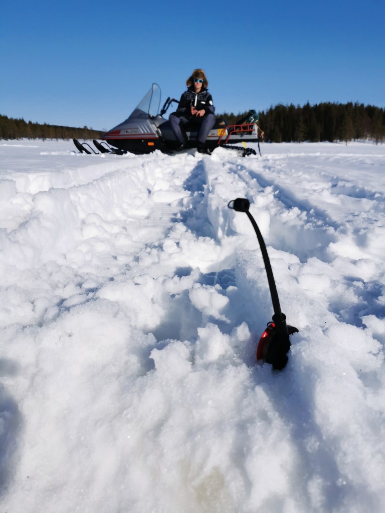 Ice Fishing with Snowmobile